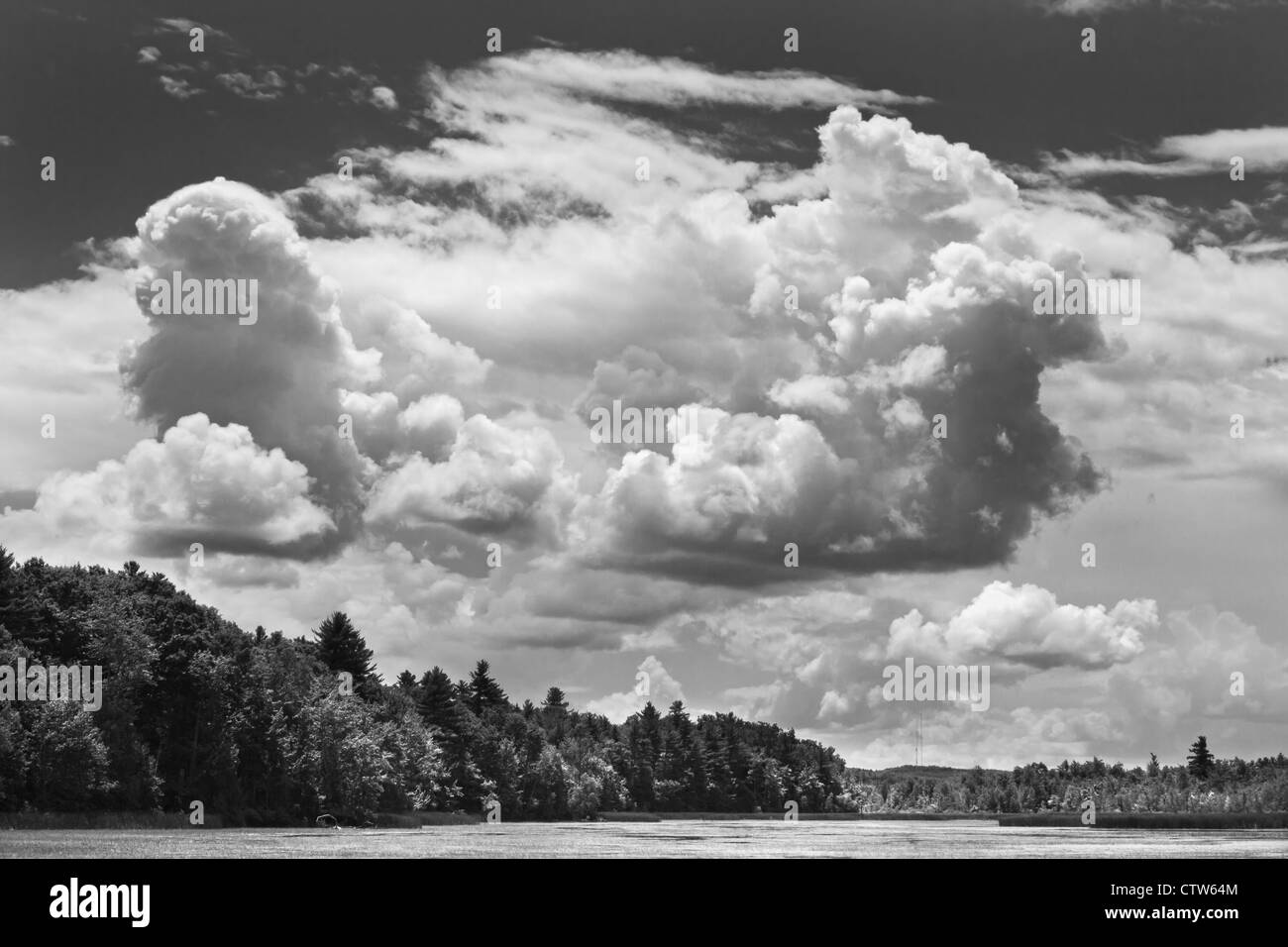 Black and white clouds over Cobbossee Lake Litchfield Maine Stock Photo