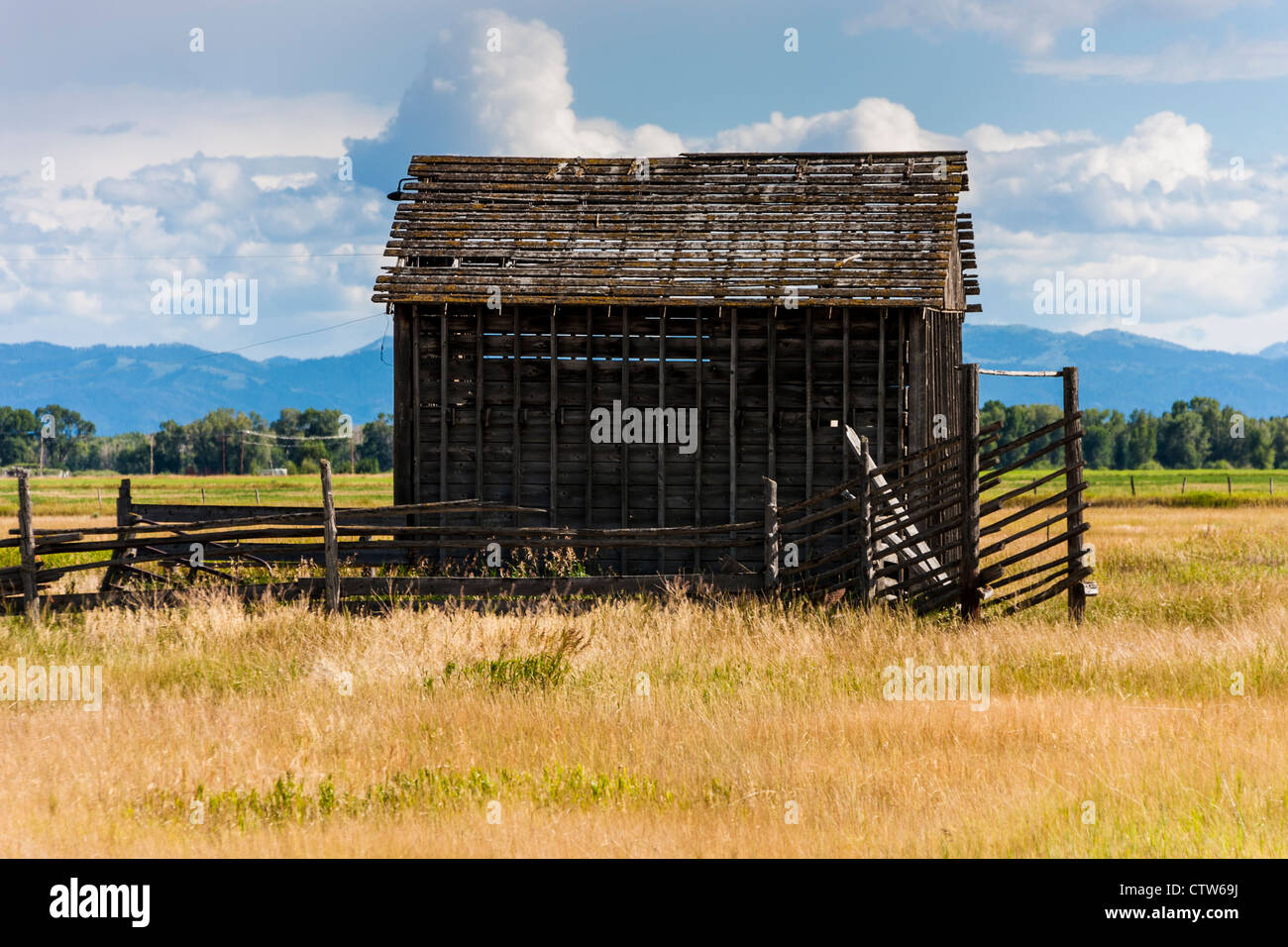 Abandoned barn on Idaho farm in the Teton valley, on the western side of the Teton mountain range. Stock Photo