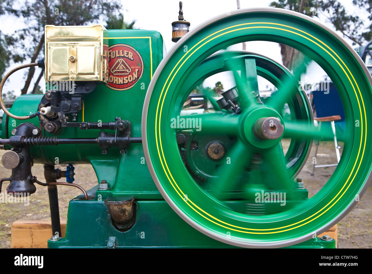 Spining Engine spinning drive shaft of antique engine Stock Photo - Alamy