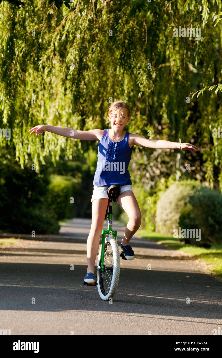 Girl riding unicycle hires stock photography and images Alamy