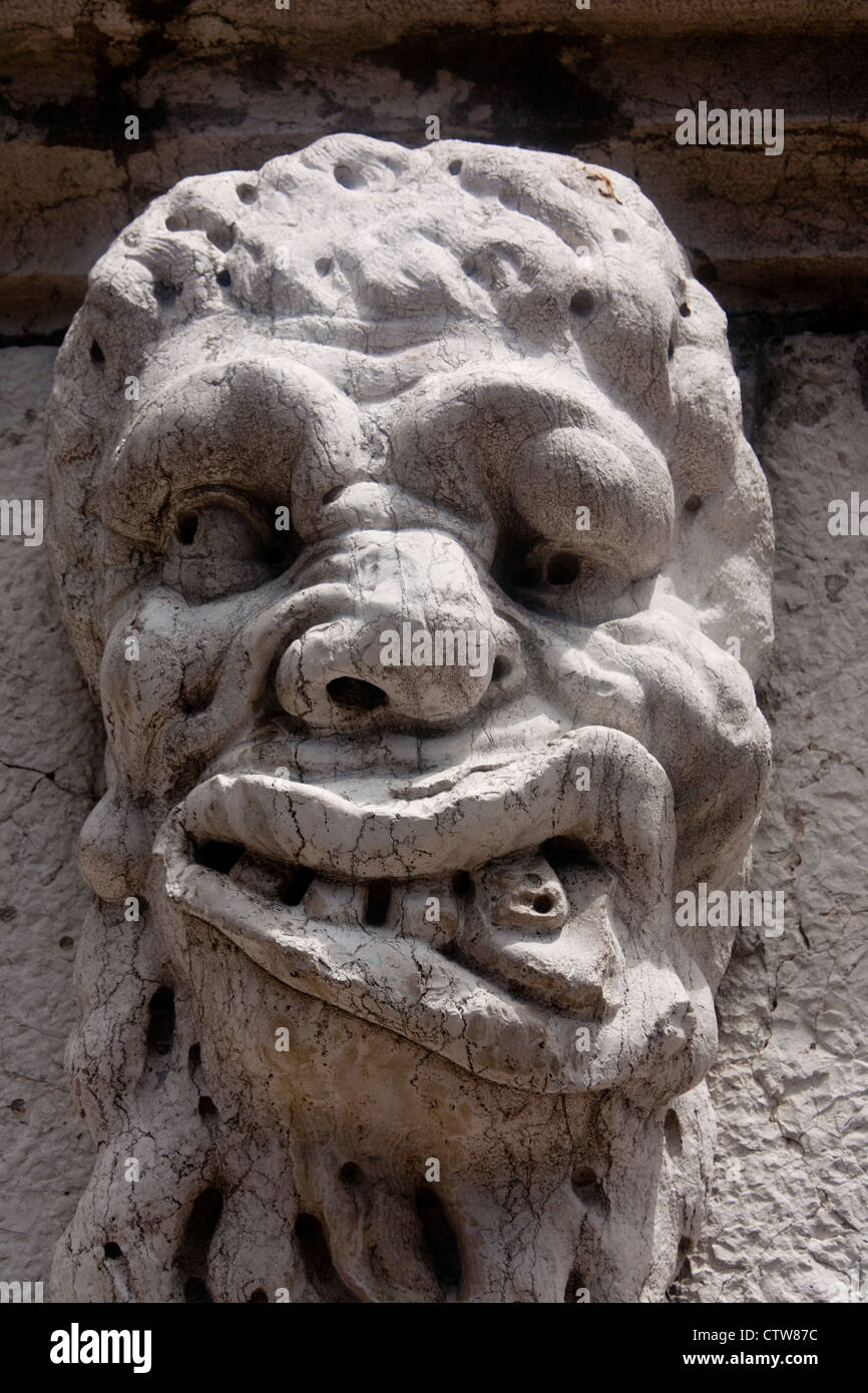 Grotesque male gargoyle figure on exterior of Santa Maria Formosa church Castello sestier Venice Veneto Italy Stock Photo