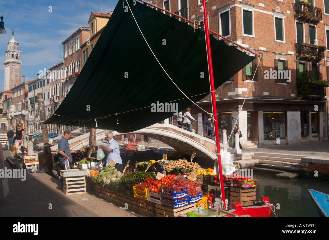 Fruit and vegetable stall on boat moored on Rio San Barnaba Dorsoduro sestier Venice Veneto Italy Stock Photo