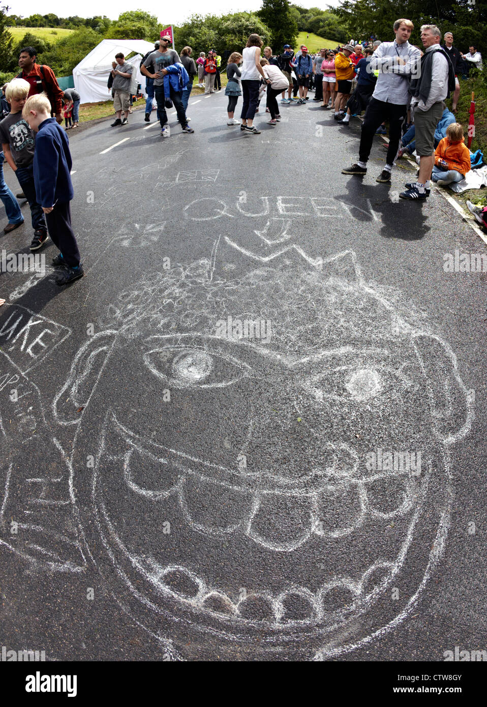 Boys Writing On the Cycle Track For the Road Race at Box Hill 2012 Olympics UK Stock Photo