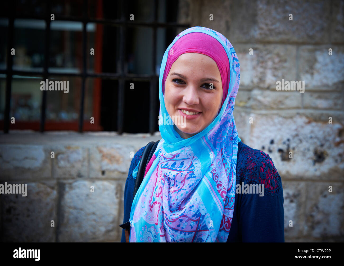 Portrait of Smiling Young Muslim Woman / Girl wearing veil / hijab, Sarajevo Bosnia and Herzegovina Stock Photo