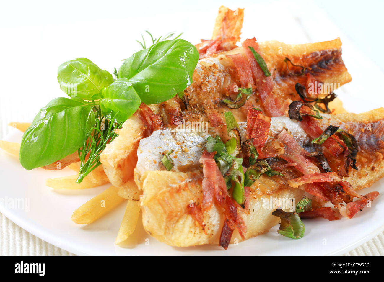 Pan fried fish fillets with French fries Stock Photo