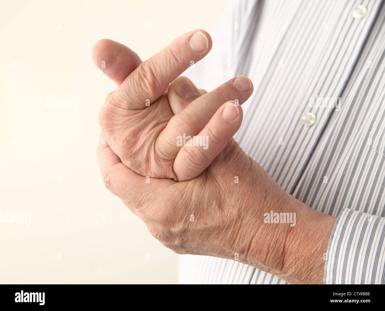 a man with pain in his fingers Stock Photo