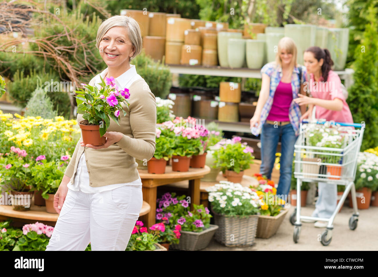 Lady green garden centre hi-res stock photography and images - Alamy