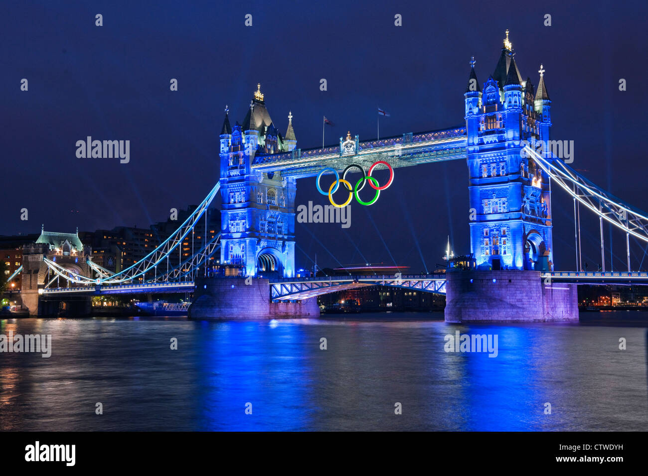 A light show on Tower Bridge with Olympic Rings  precedes a firework display at the commencement of the Olympic Games 2012 Stock Photo