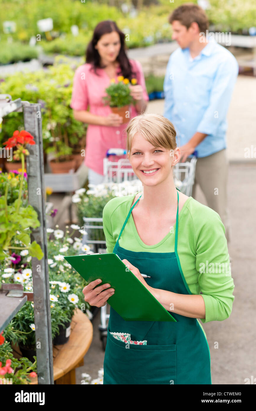 Female florist working at garden center do retail inventory Stock Photo