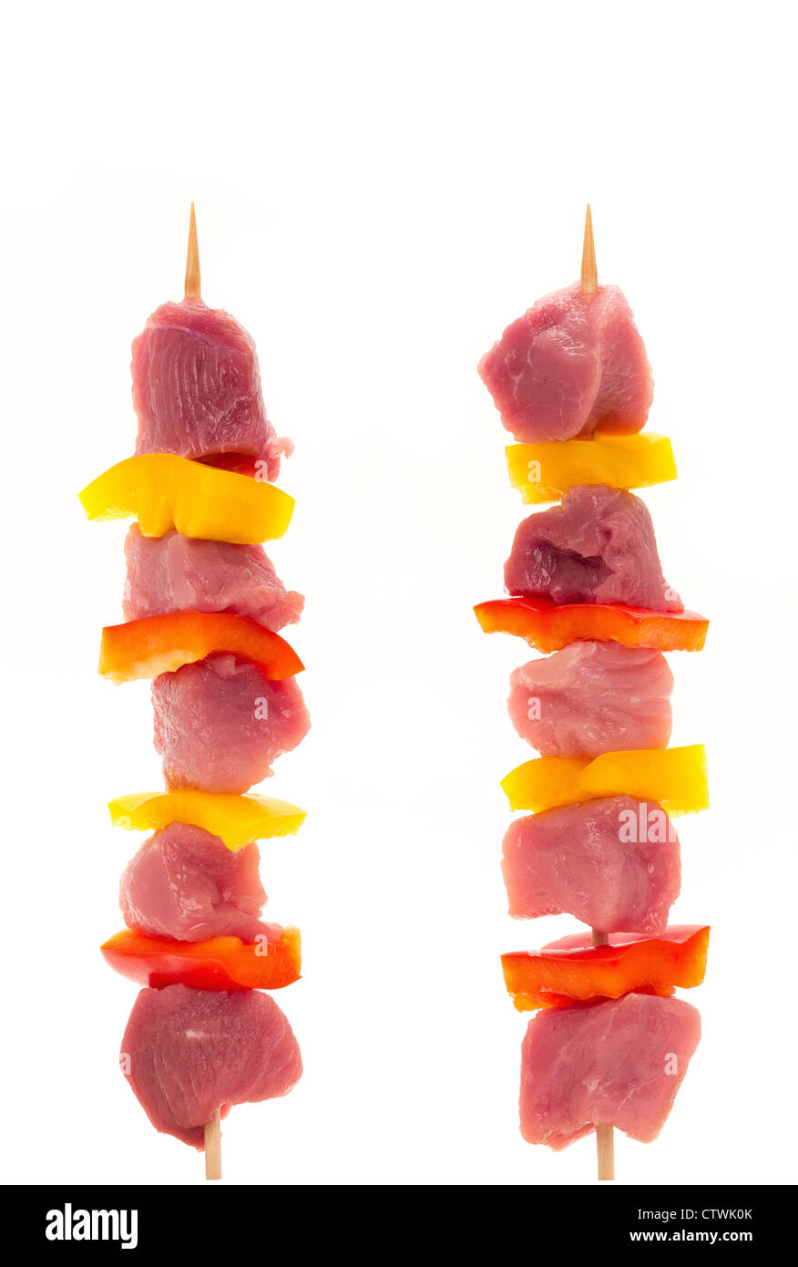 Two fresh pork shish kebobs on a white background - studio shot Stock Photo