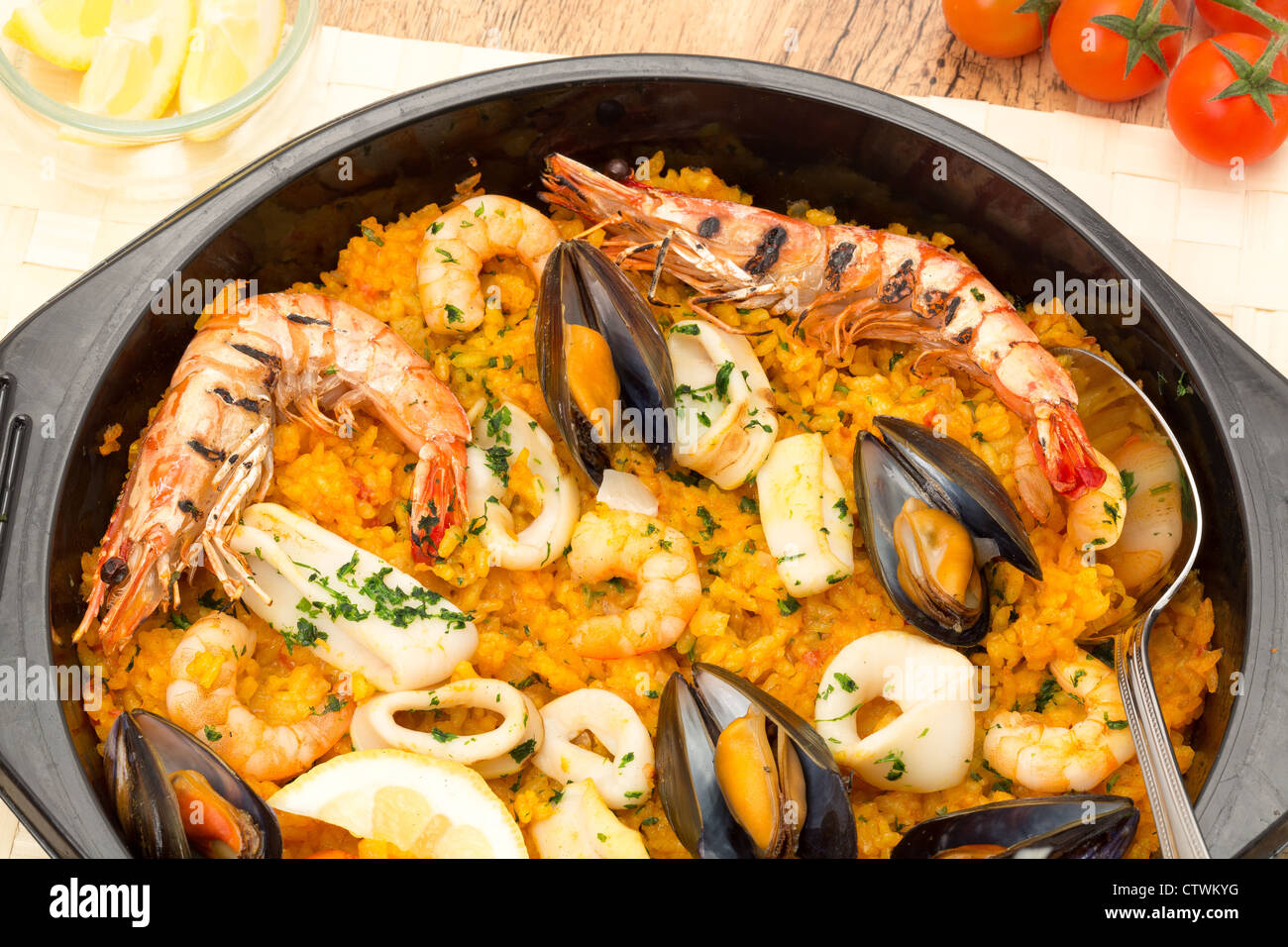Seafood paella in a black paella pan Stock Photo Alamy