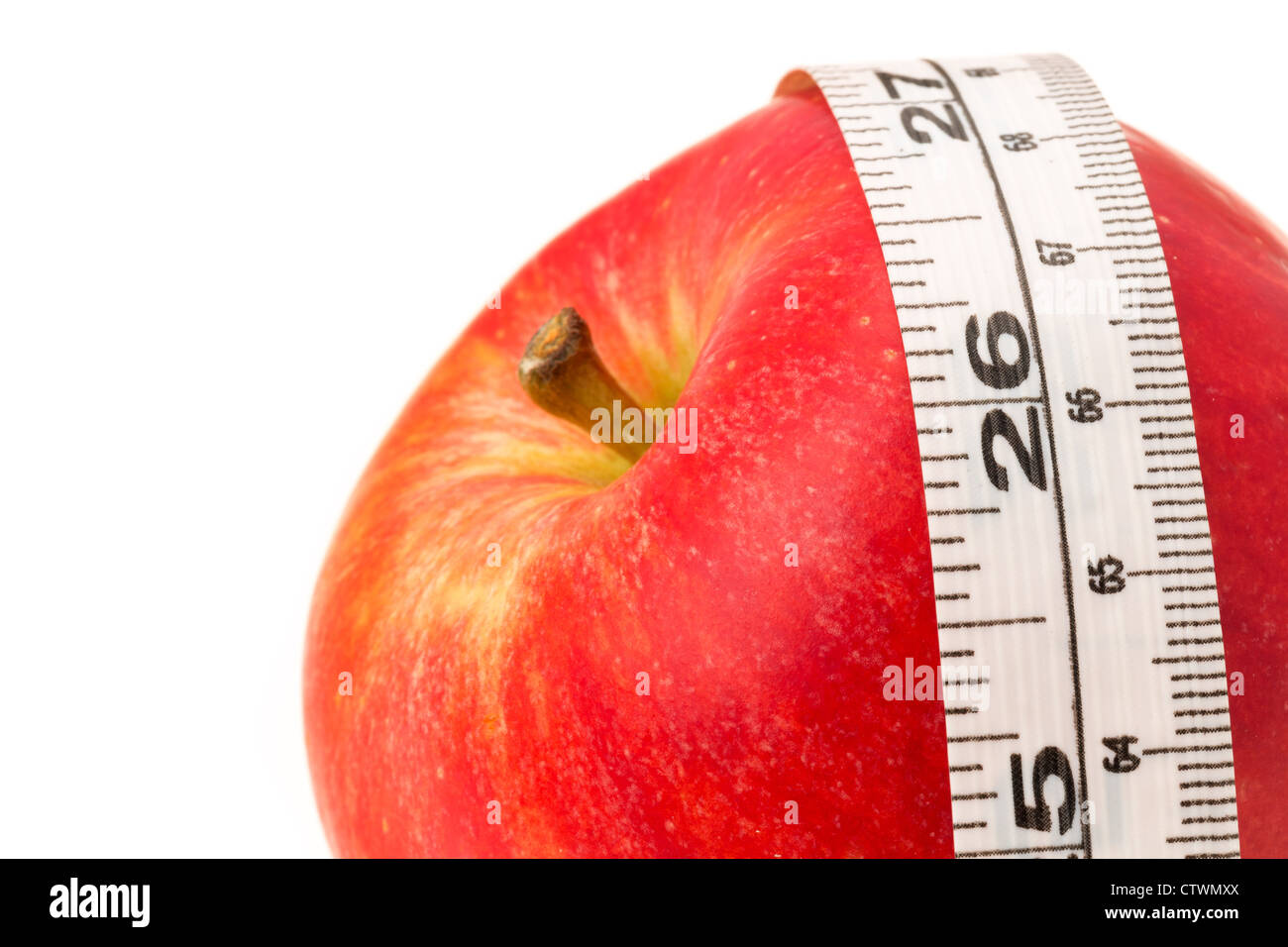 Red apple with a measuring tape - diet concept - studio shot Stock Photo