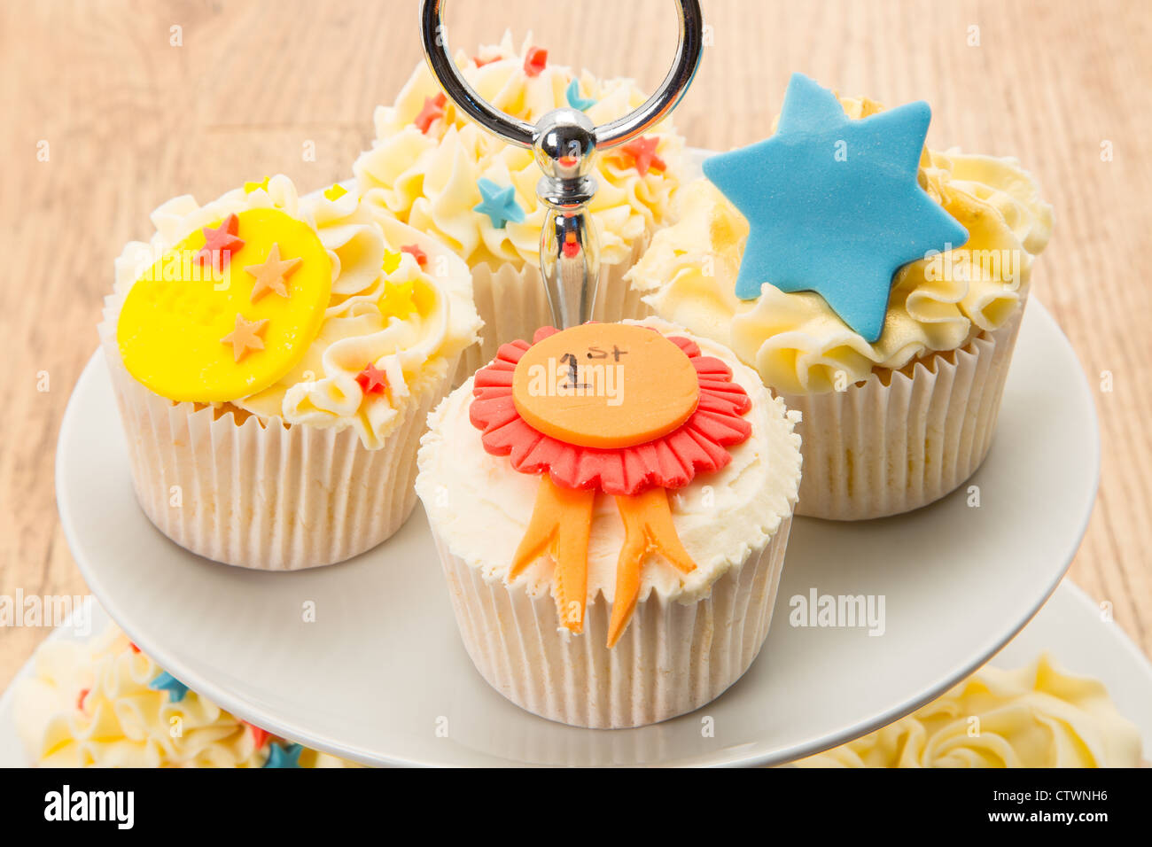 Various cupcakes on a two tier cake stand - studio shot Stock Photo