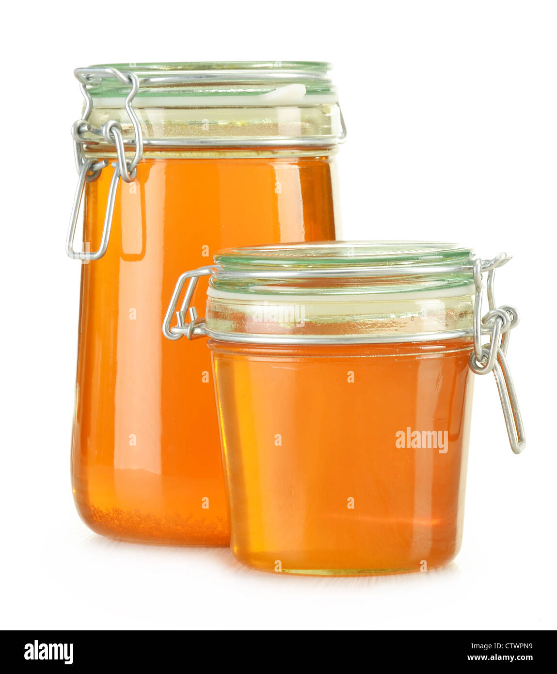Jars of honey isolated on white Stock Photo Alamy