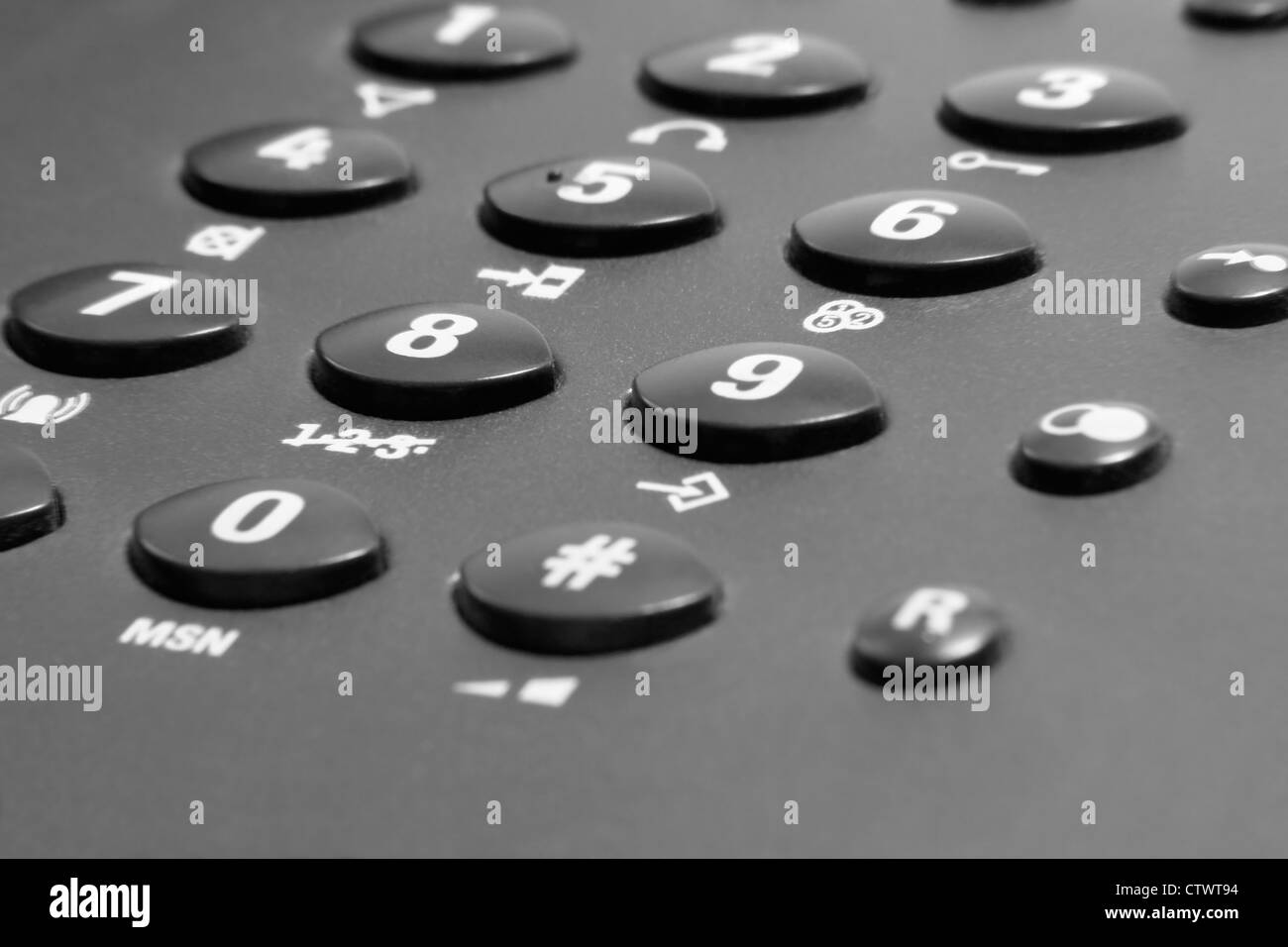 dark telephone keypad closeup with white numbers Stock Photo
