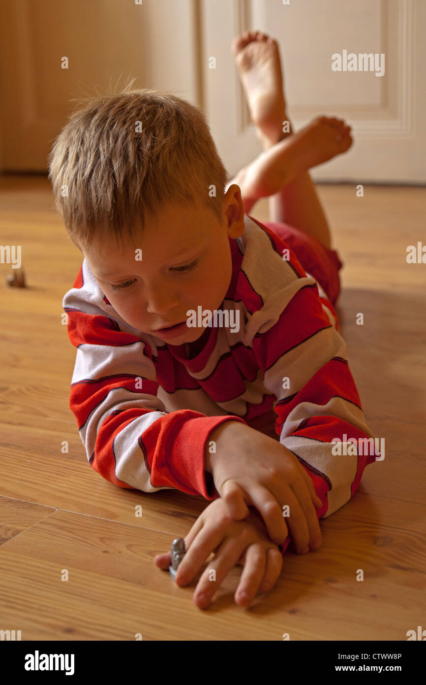 young boy playing with toy puppet Stock Photo