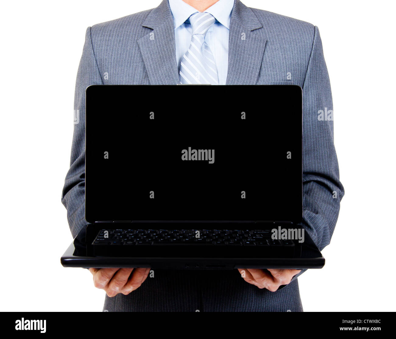 Business man holding a blank laptop for copy space on isolated background Stock Photo