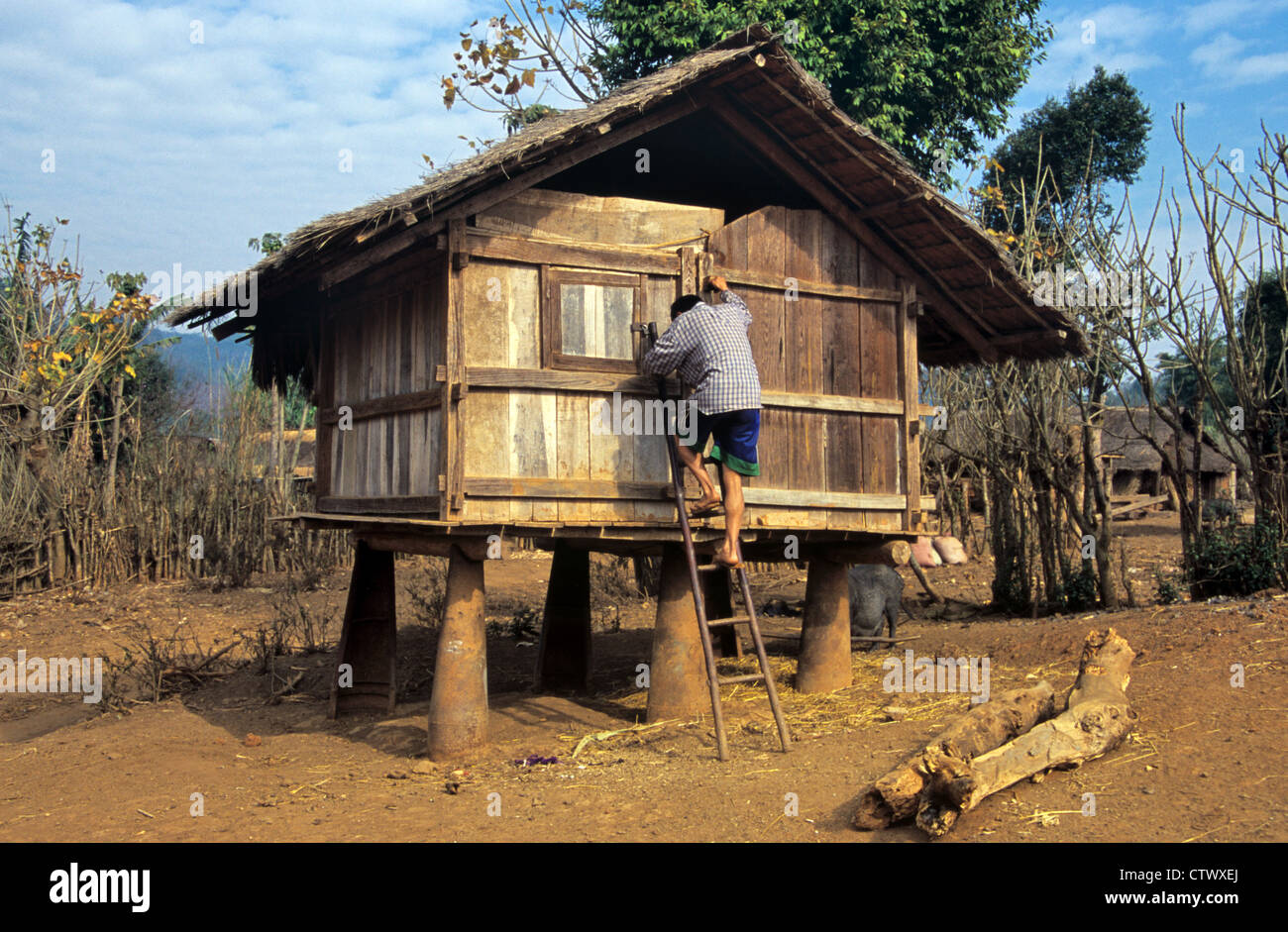 Rice Store or Agricultural Storage Building Raised Up on Casings of US Cluster Bombs near Phonsavan Xieng Khuang Laos Stock Photo