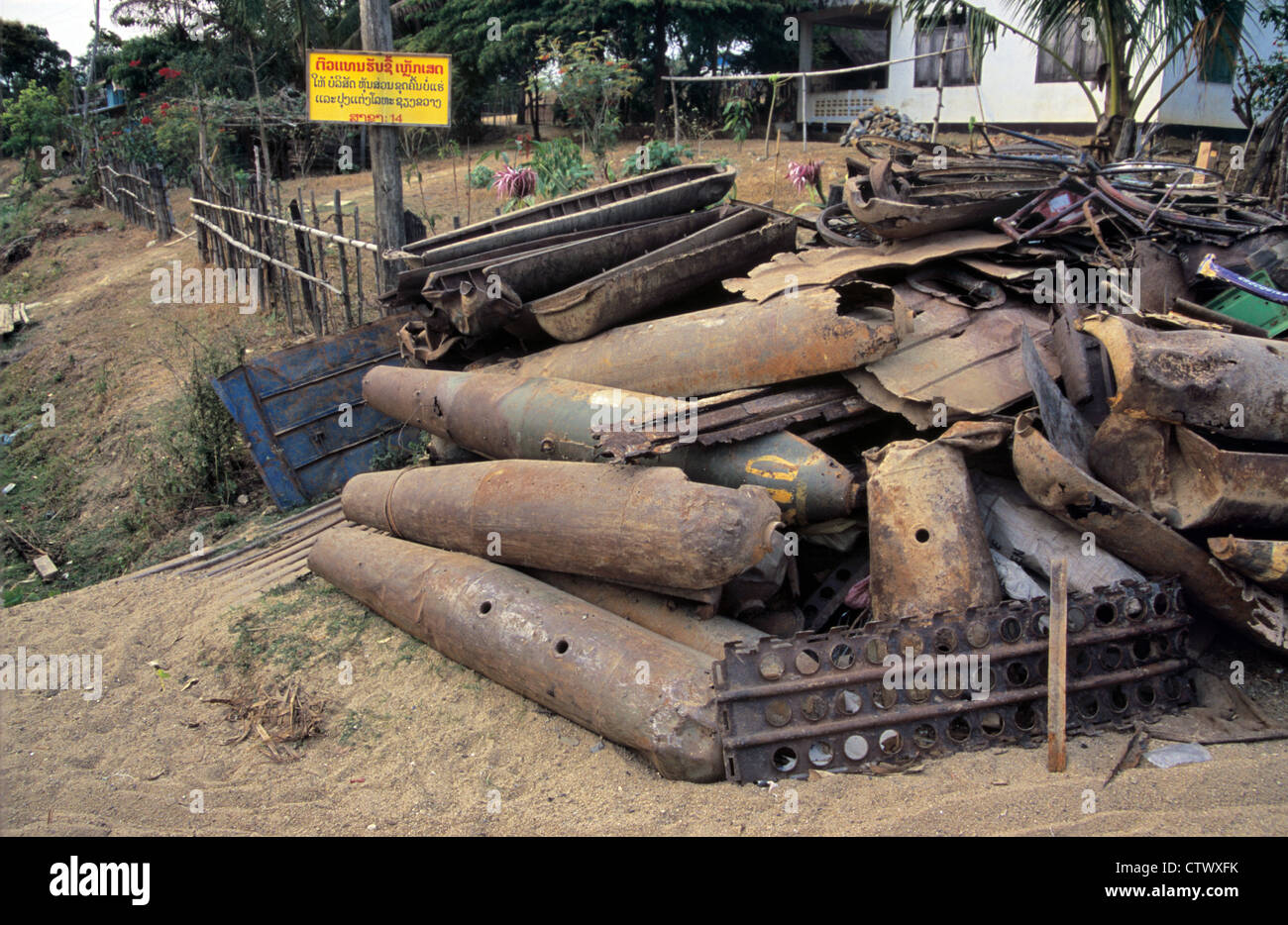Scrap Metal of US Phonsavan Cluster Bomb Cases from Vietnam War Piled Up in Scrap Yard in Phonsavan Laos Stock Photo
