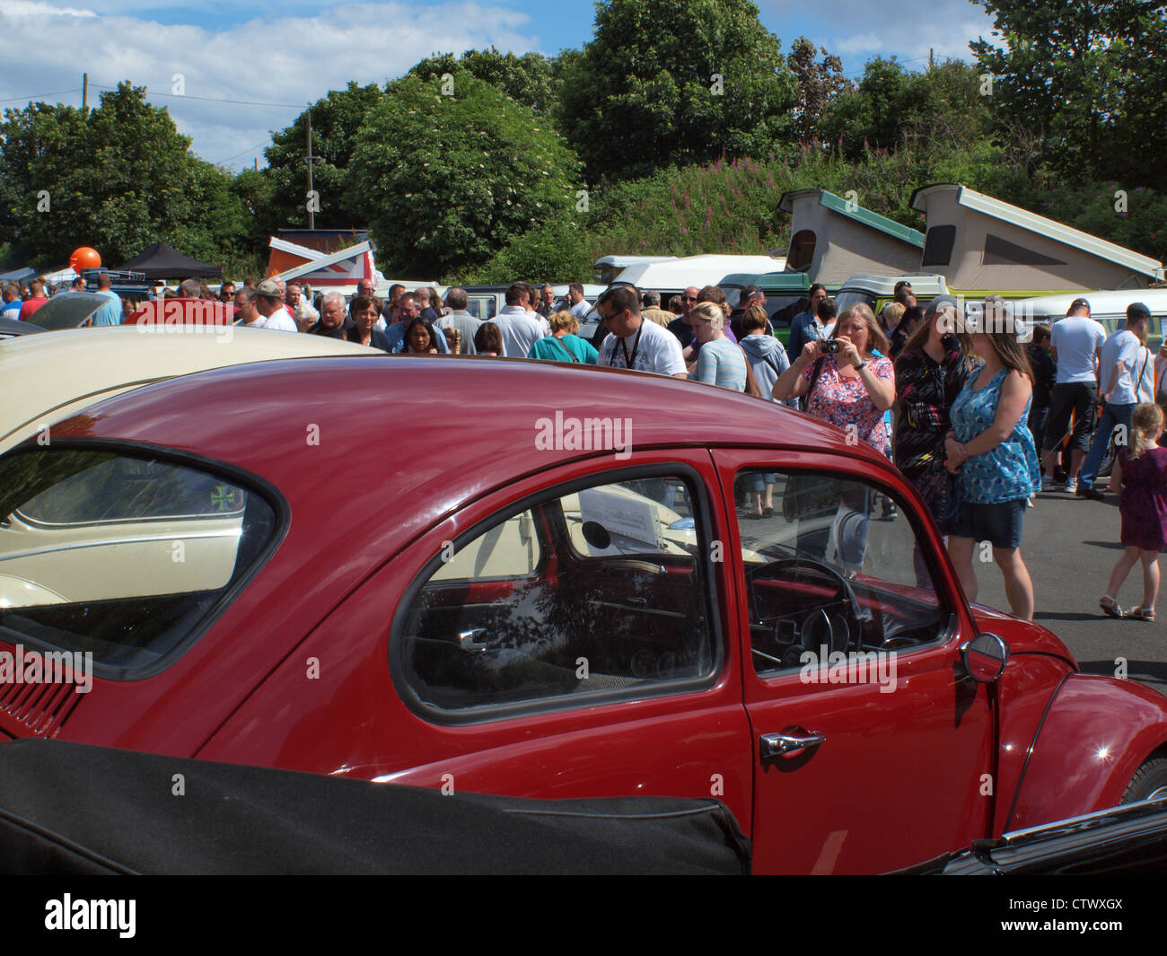 Crowds of people gathering at a vintage Volkswagen classic Car and Van festival in Northern England. Stock Photo