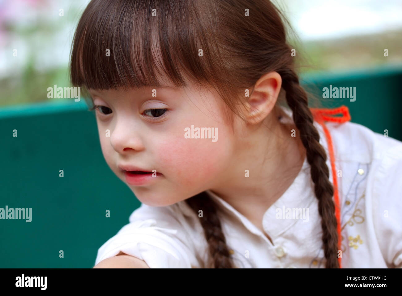 Portrait of beautiful young girl on the playground Stock Photo - Alamy