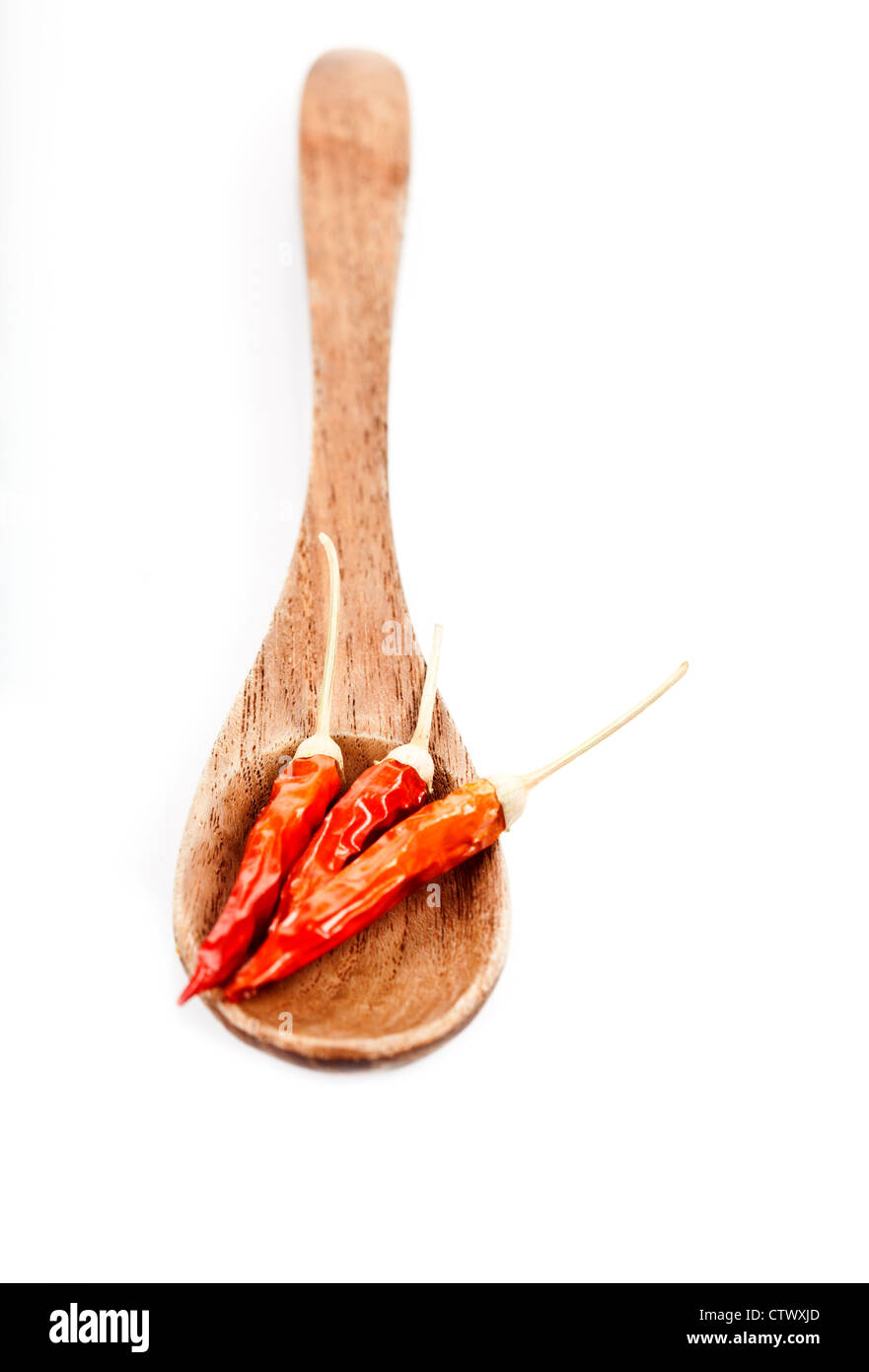 Wooden spoon with red peppers Stock Photo