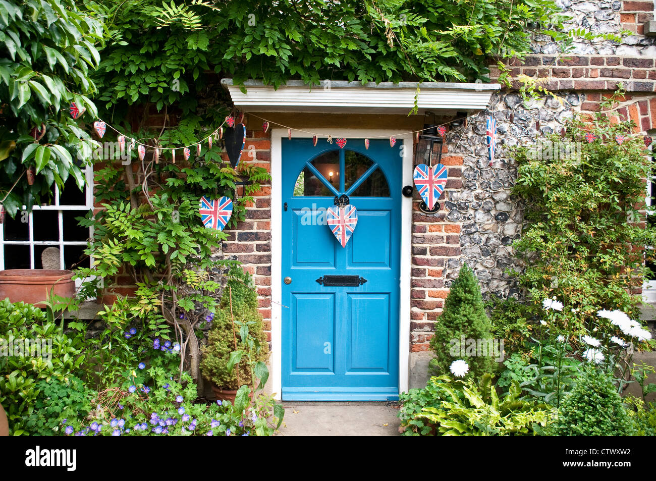 House decorated with heart shaped Union Jacks, Downe, Kent, England, UK Stock Photo