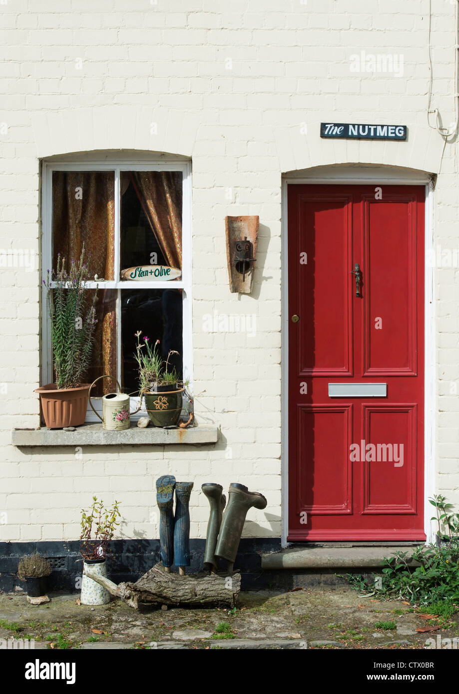 Quirky english colourful red door and house name. The Nutmeg. Eardisland. Herefordshire, England Stock Photo