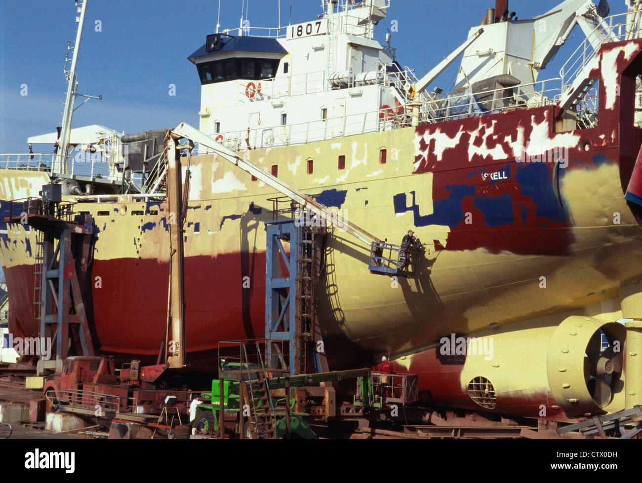 A dry docked ship in Iceland being painted. Stock Photo