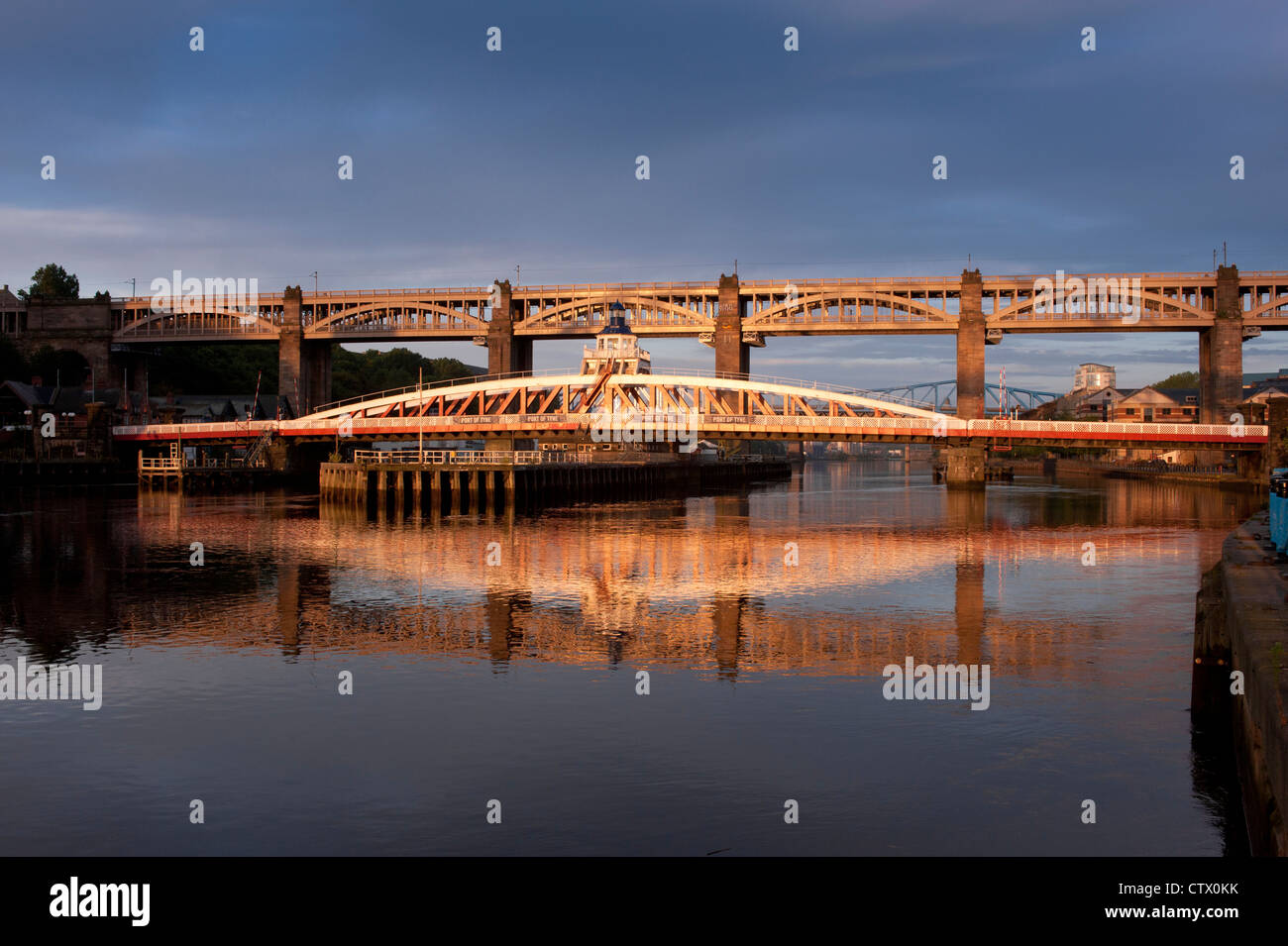 NEWCASTLE, UK - AUGUST 02, 2012:   The Swing Bridge and High level  Bridge over the River Tyne lit by early morning sun Stock Photo