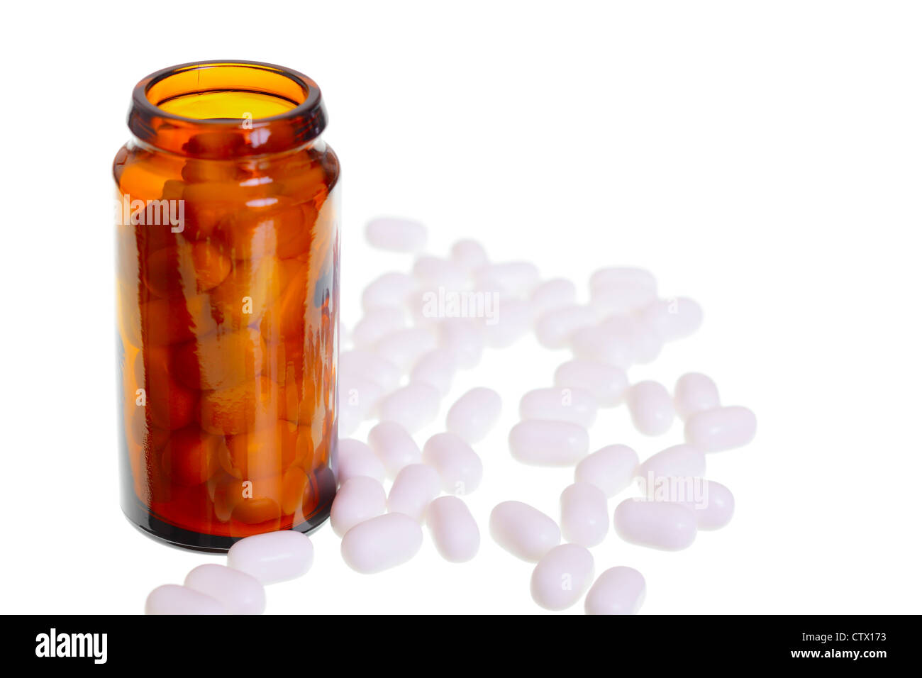 A empty pill jar and white pills isolated on white background, studio shoot, Adobe RGB. Stock Photo