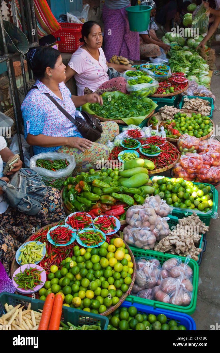 LIMES, CHILES, POTATOES and VEGETABLES for sale at the CENTRAL MARKET in KENGTUNG also known as KYAINGTONG - MYANMAR Stock Photo