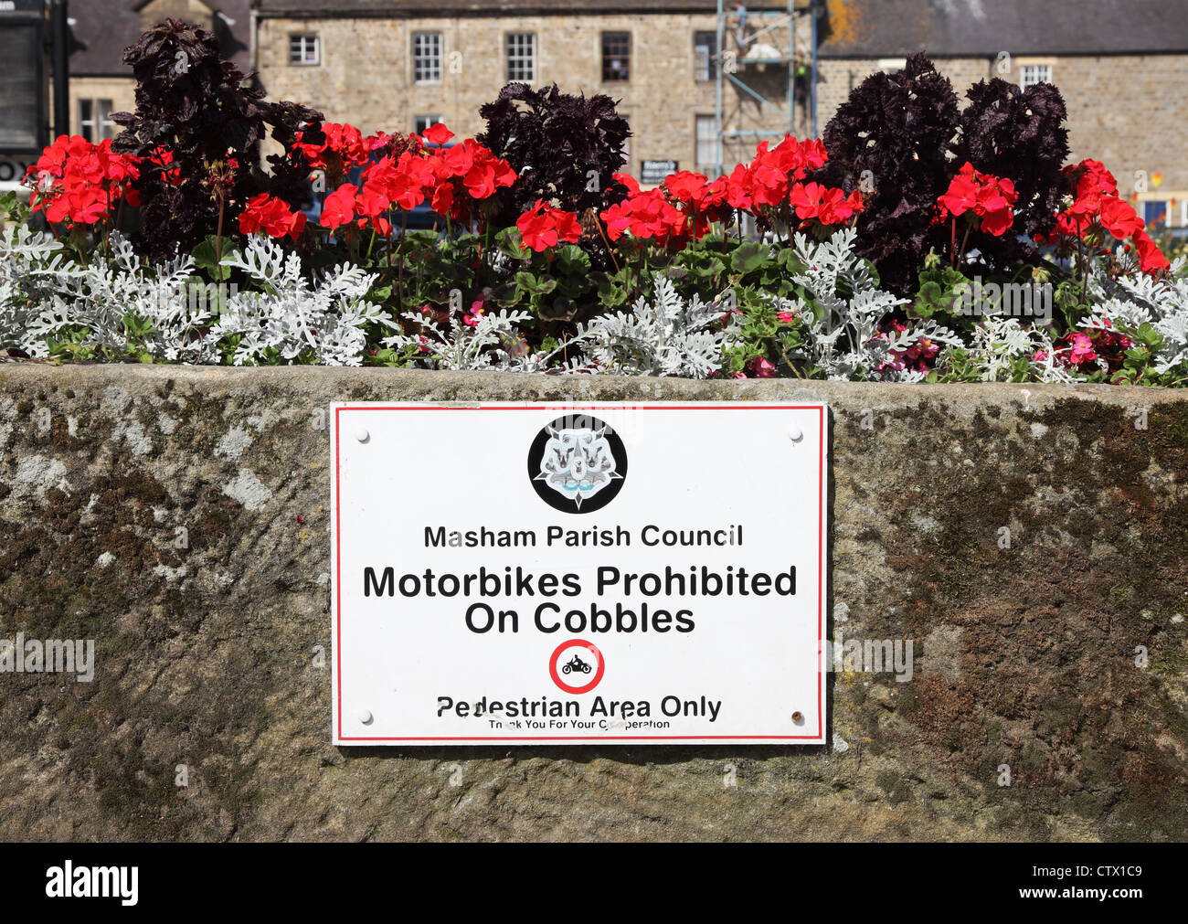 Unusual sign Motorbikes Prohibited on Cobbles at  Masham, Yorkshire, England, UK Stock Photo