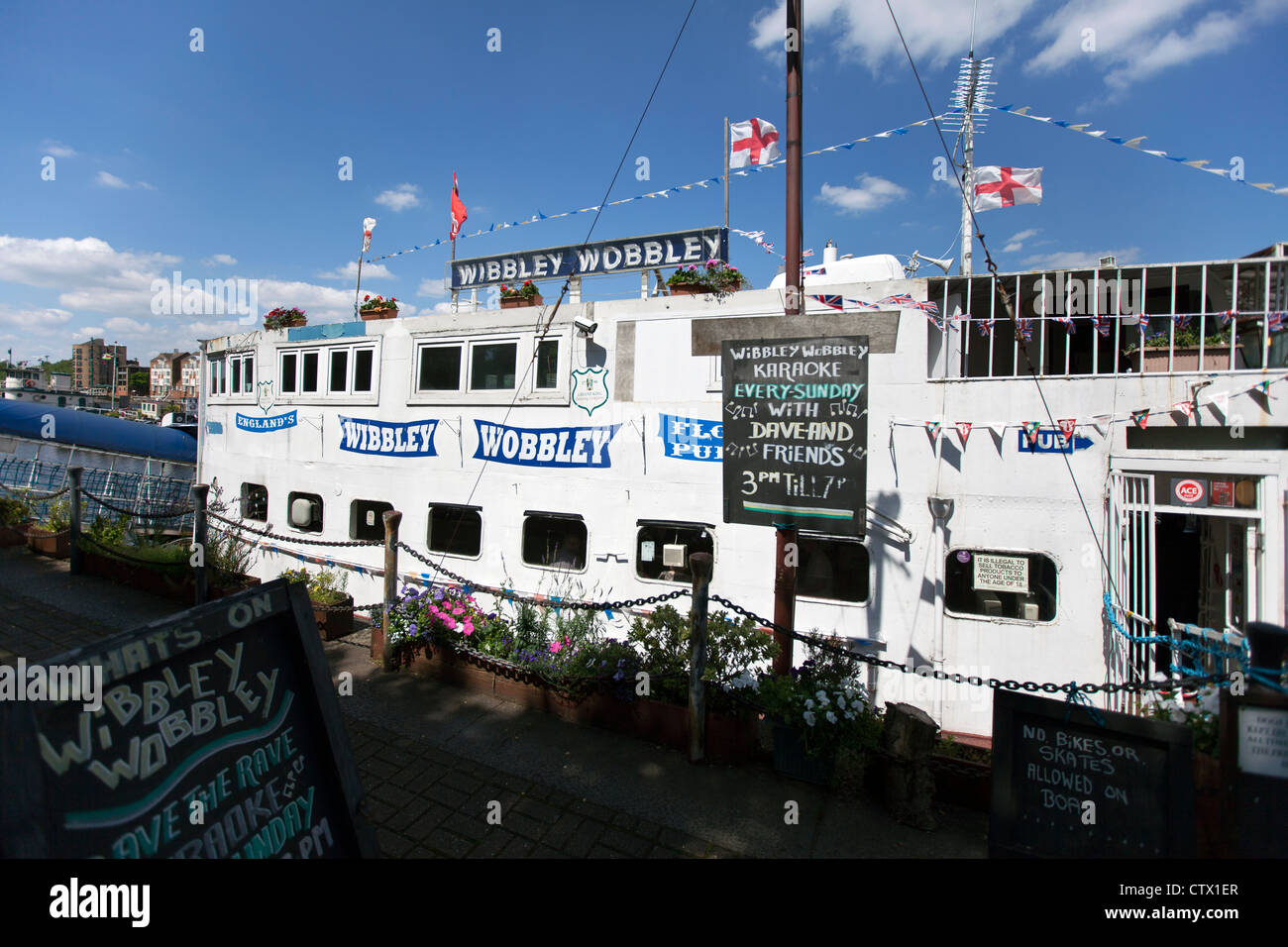 The Wibbley Wobbley Pub is a converted barge in Greenland Dock, Rotherhithe, London, England, UK. Stock Photo