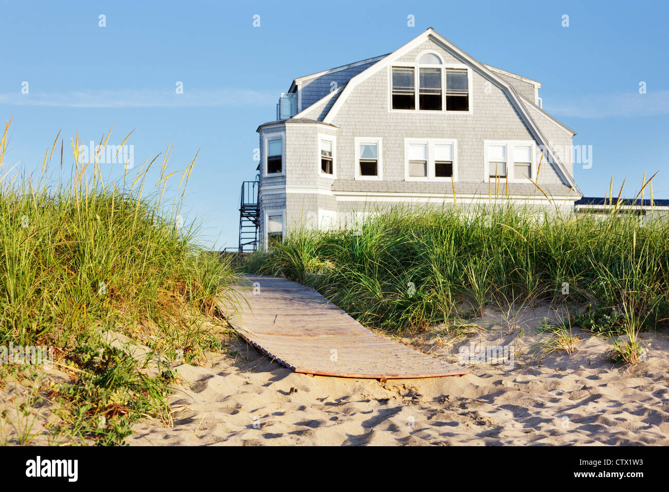 New England Beach House By The Boardwalk In Early Morning Sun Stock Photo Alamy