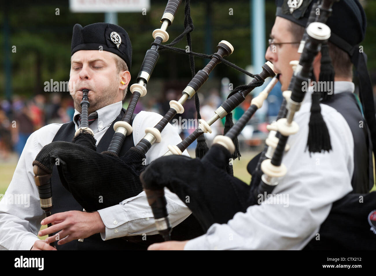Bagpipers performing at the 66th Annual Pacific Northwest Scottish Highland Games and Clan Gathering - Enumclaw, Washington. Stock Photo