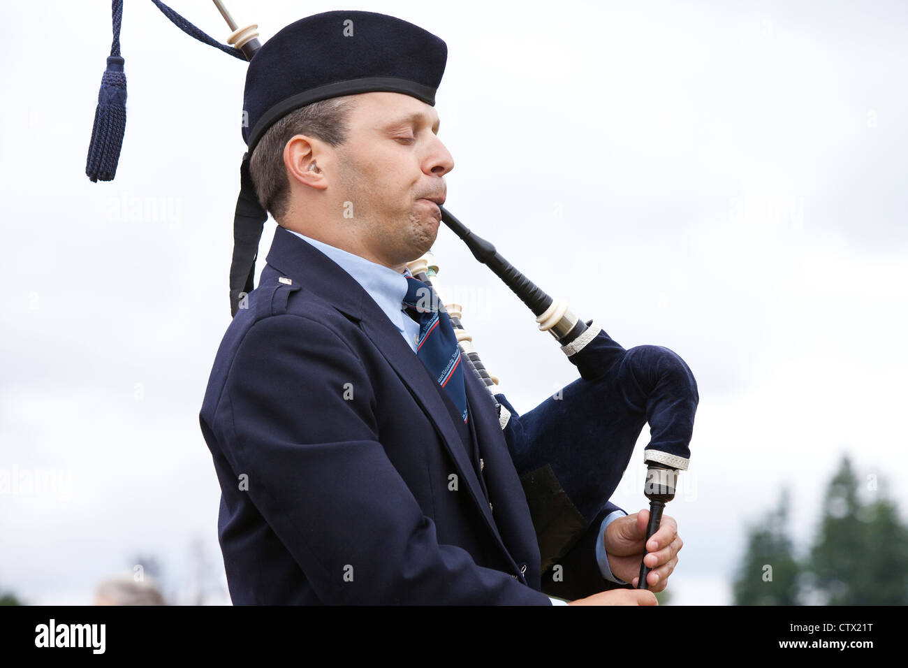 Bagpiper performing at the 66th Annual Pacific Northwest Scottish Highland Games and Clan Gathering - Enumclaw, Washington. Stock Photo