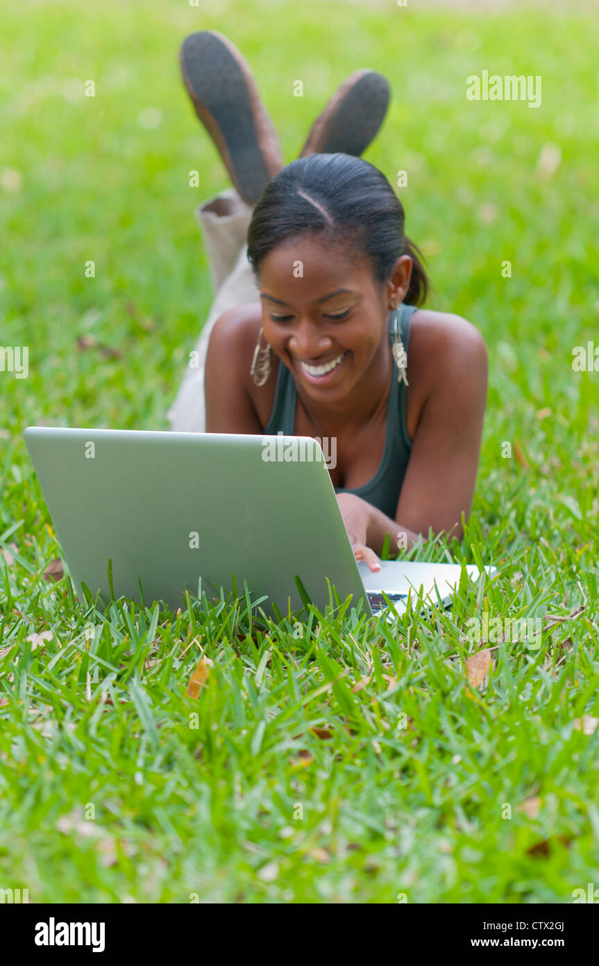 African student using laptop outdoors hi-res stock photography and ...