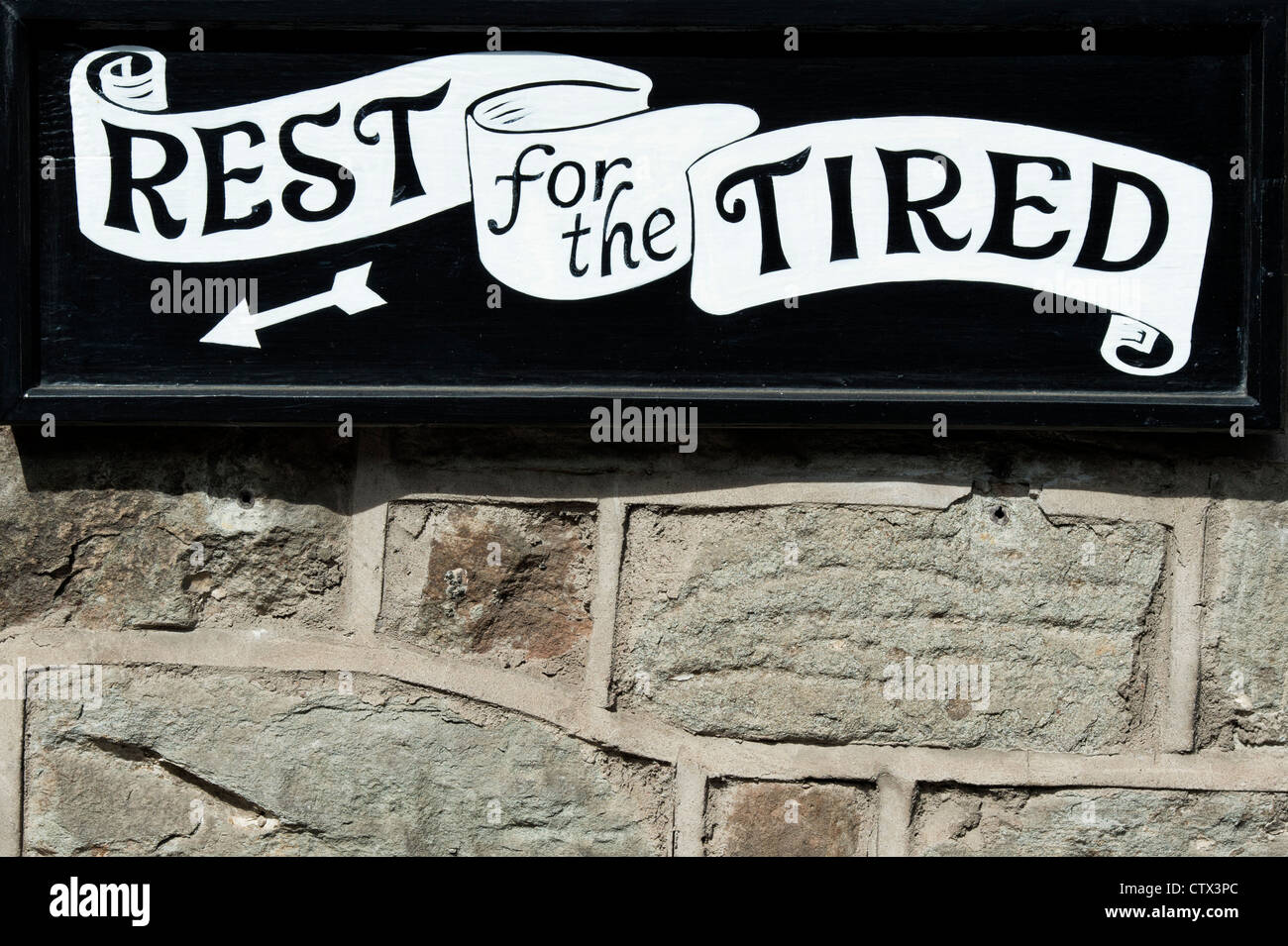 Rest for the Tired B and B sign. Hay on Wye, Powys, Wales. Stock Photo