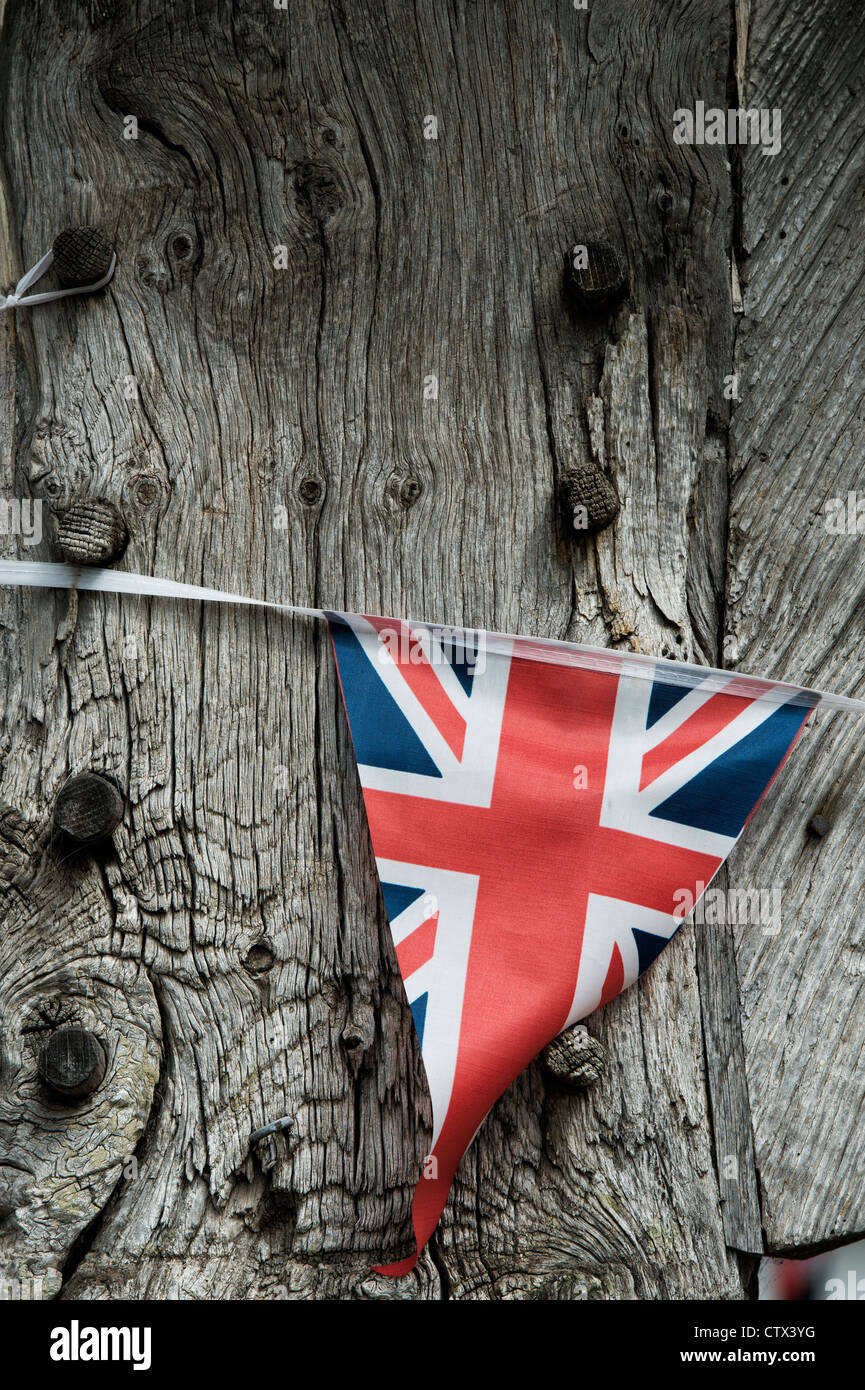 Union Jack bunting on a old cottage oak beam. Pembridge. Herefordshire. England Stock Photo