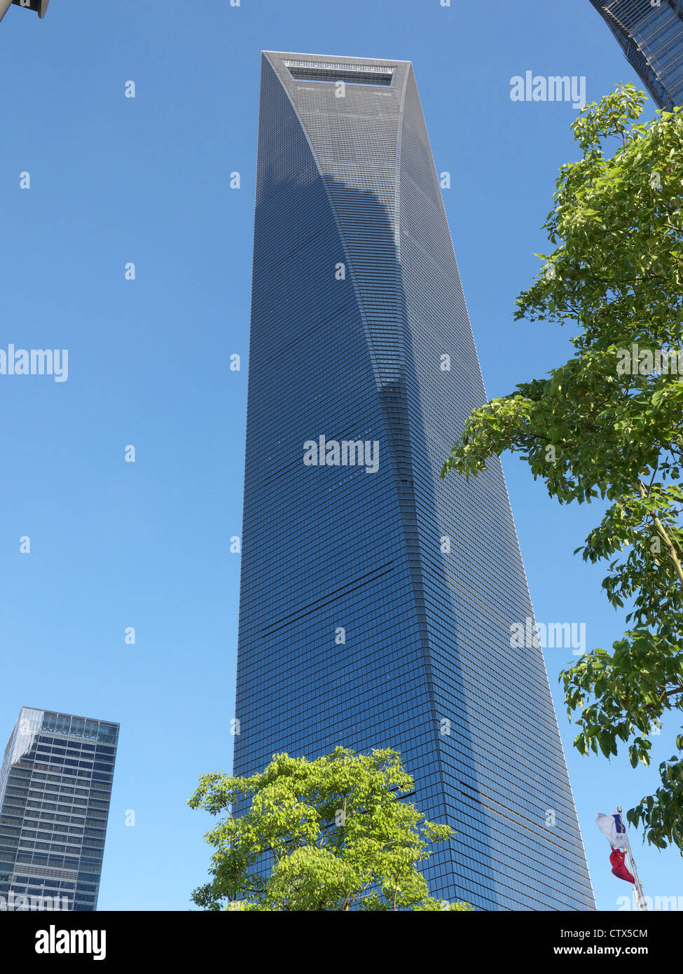 View looking up at the Shanghai World Finance Centre SWFC from Century Avenue far below Stock Photo
