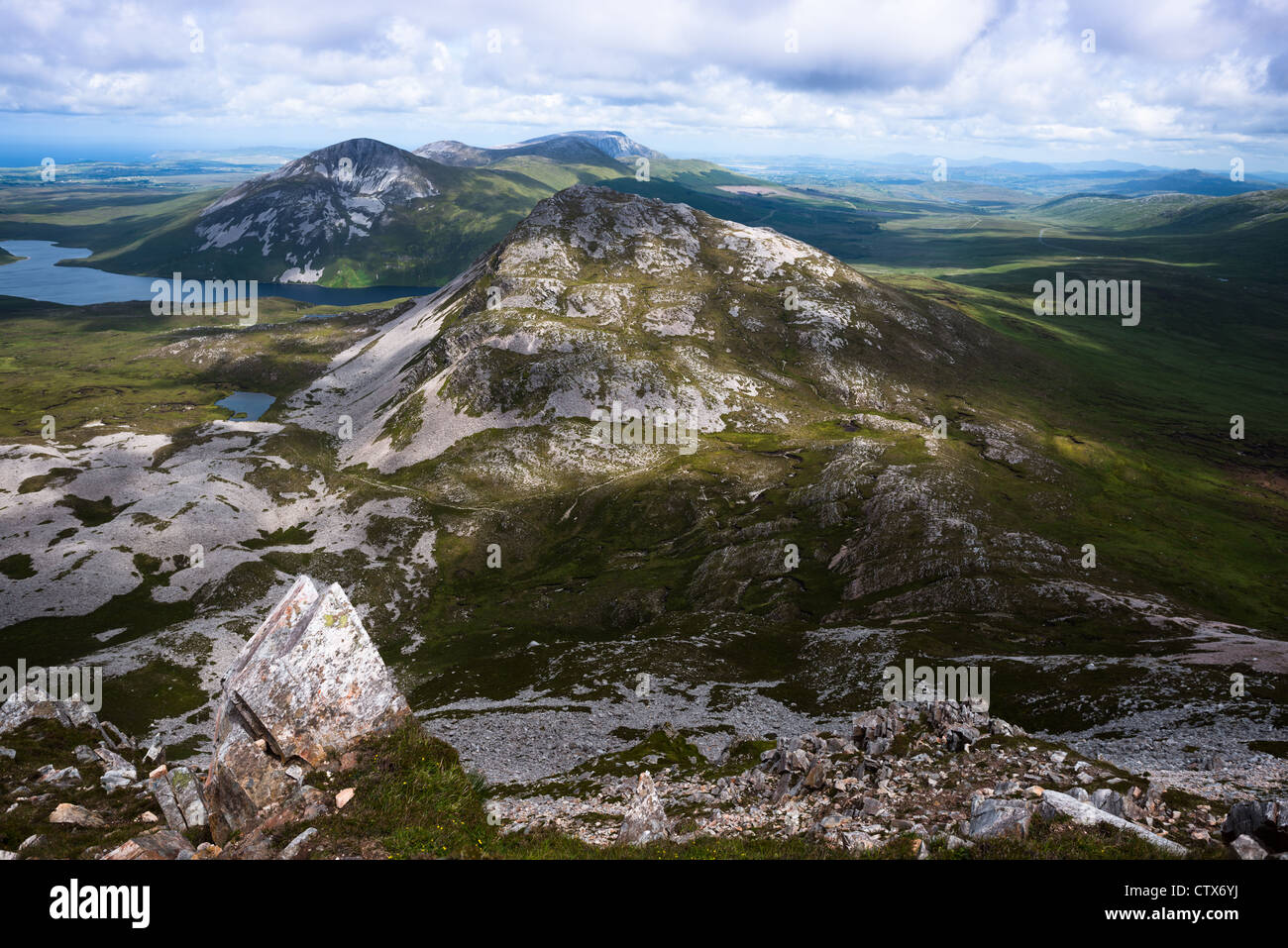 View from the summit of Mount Errigal in the range of Derryveagh Mountains in Glenveagh national park, Donegal, Ireland. Stock Photo