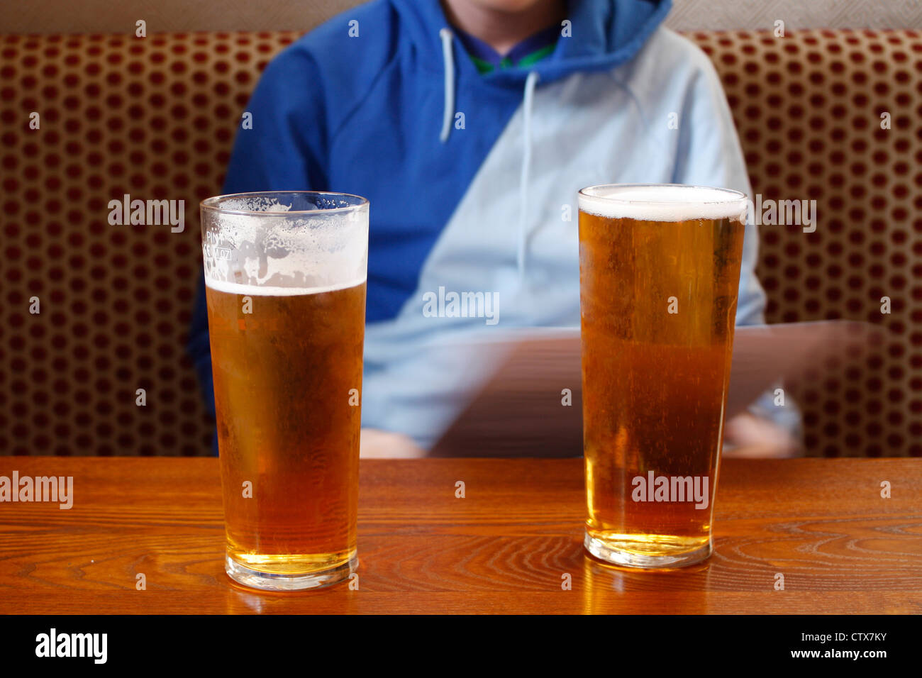 Two pints on a table in a pub Stock Photo