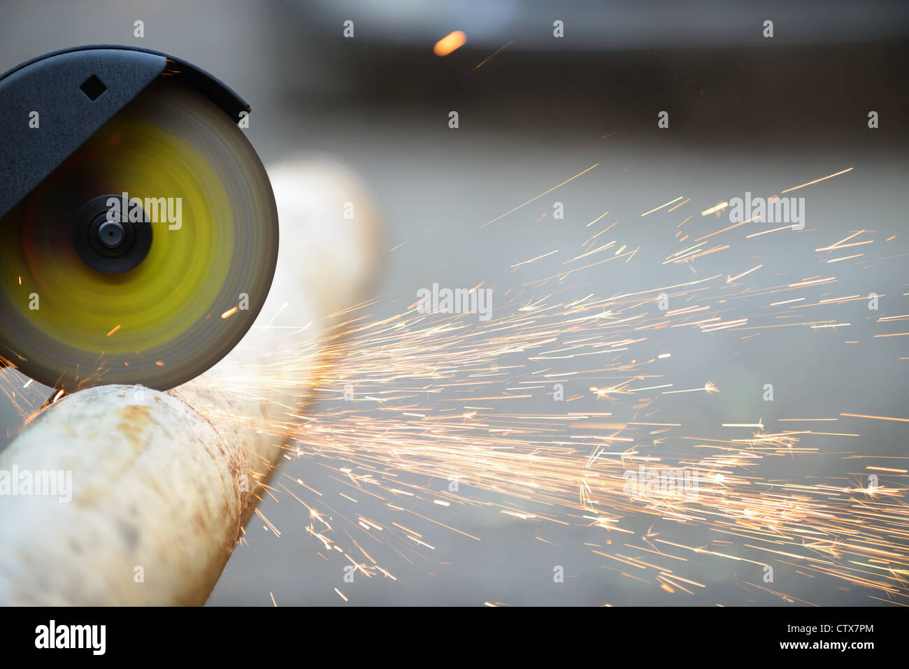 Cutting metal angle grinder, sparks from the disk. Photo close-up Stock Photo