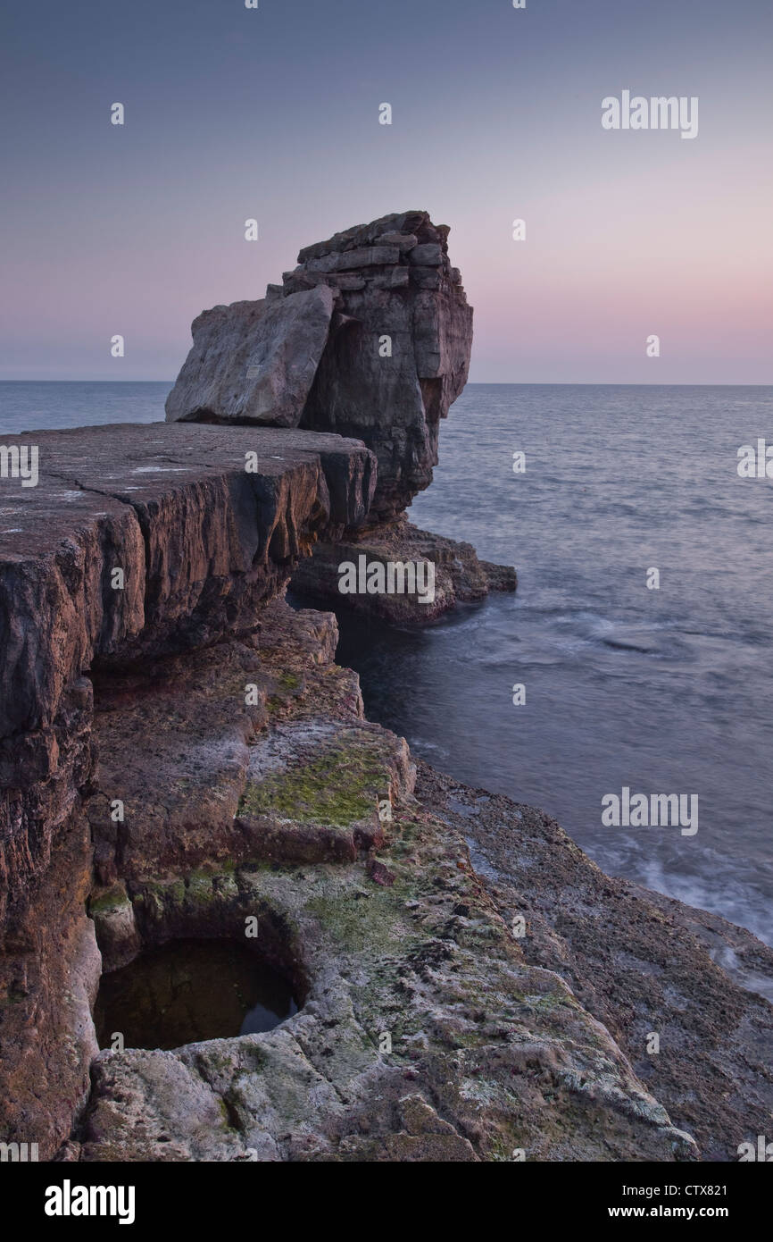 Pulpit Rock on the Dorset coastline at sunset. Stock Photo