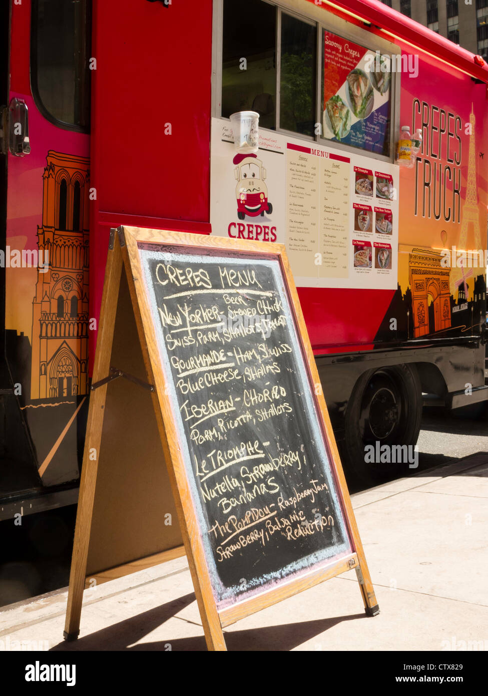 Gourmet Food Truck with Handwritten Menu Chalkboard, NYC Stock Photo