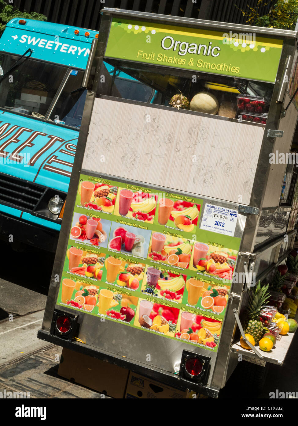 Gourmet Food Truck and Organic Fruit Cart, NYC Stock Photo Alamy