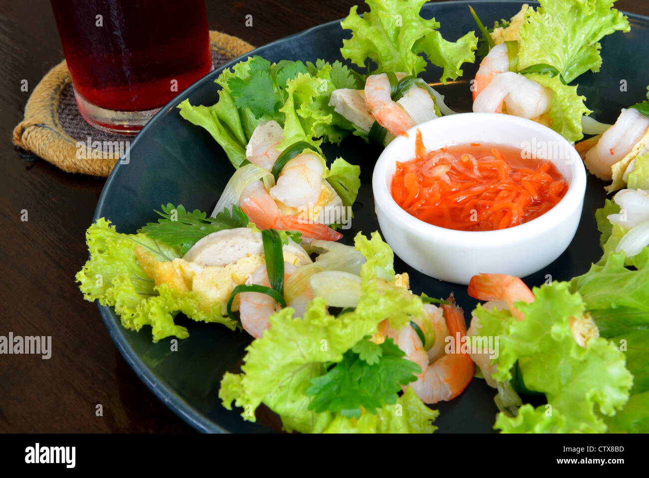 Vietnam food style call ' Shrimp salad' served on the black wooden table Stock Photo