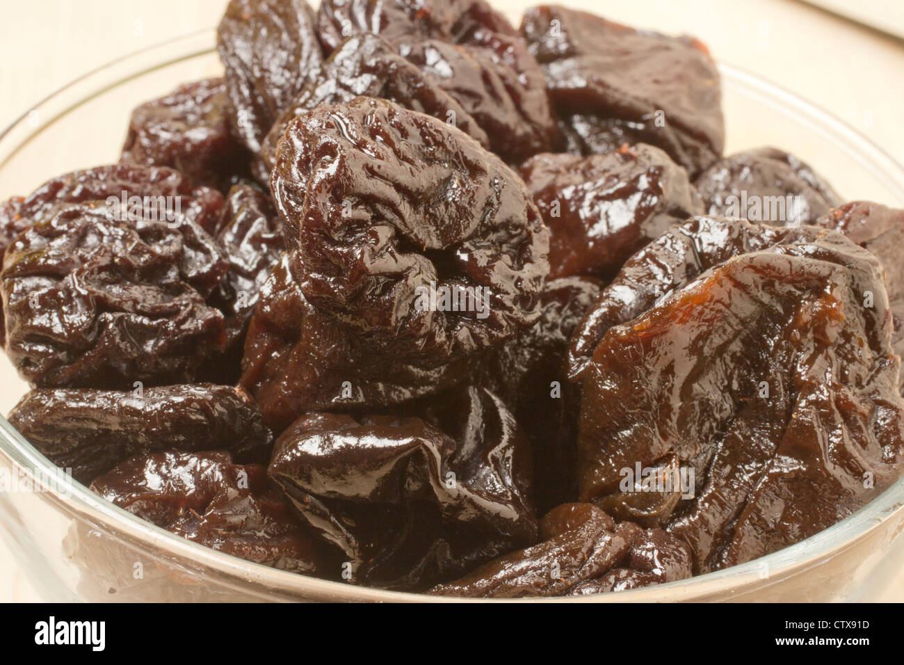 A bowl of prunes Stock Photo