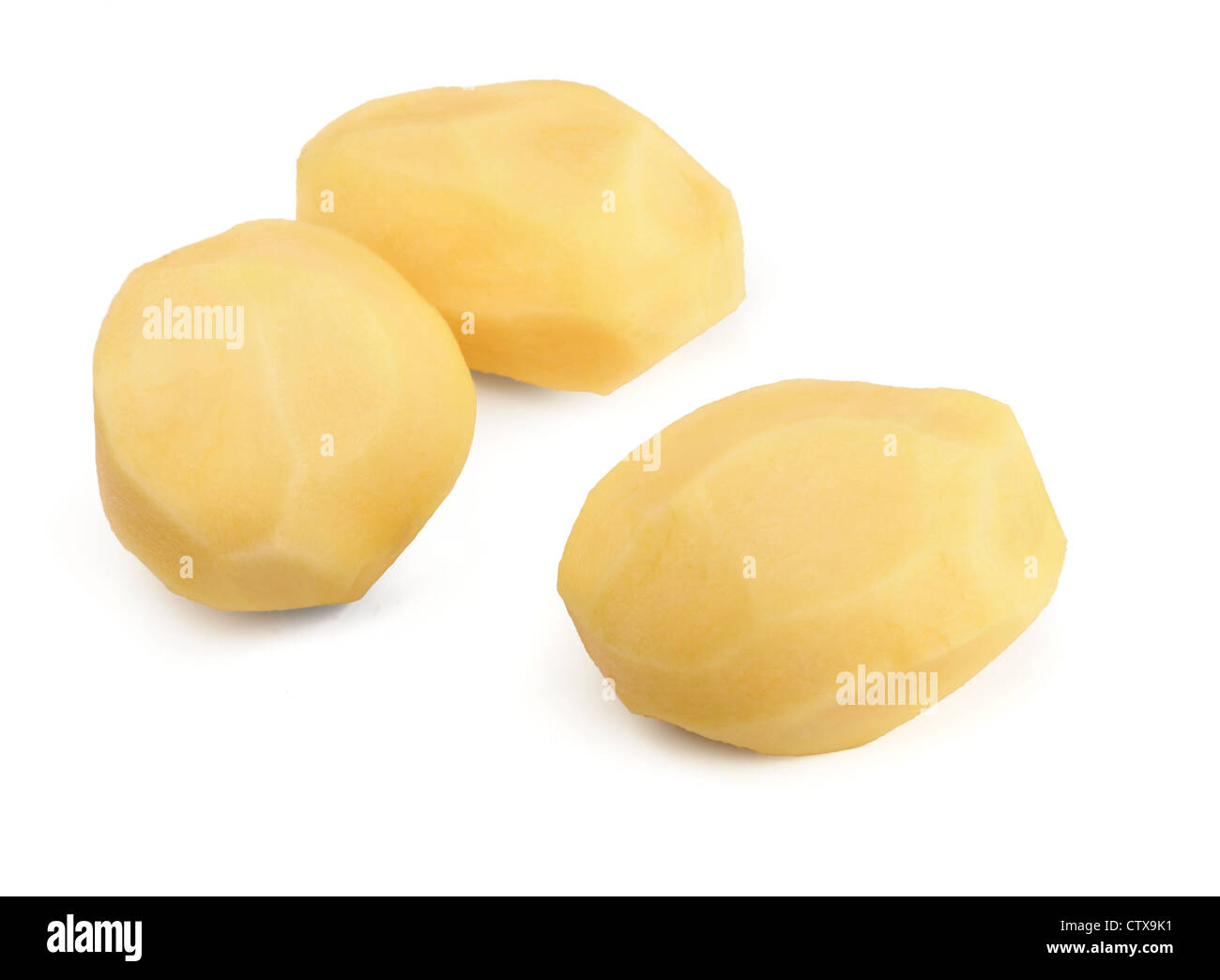 Three raw peeled potatoes isolated on white Stock Photo